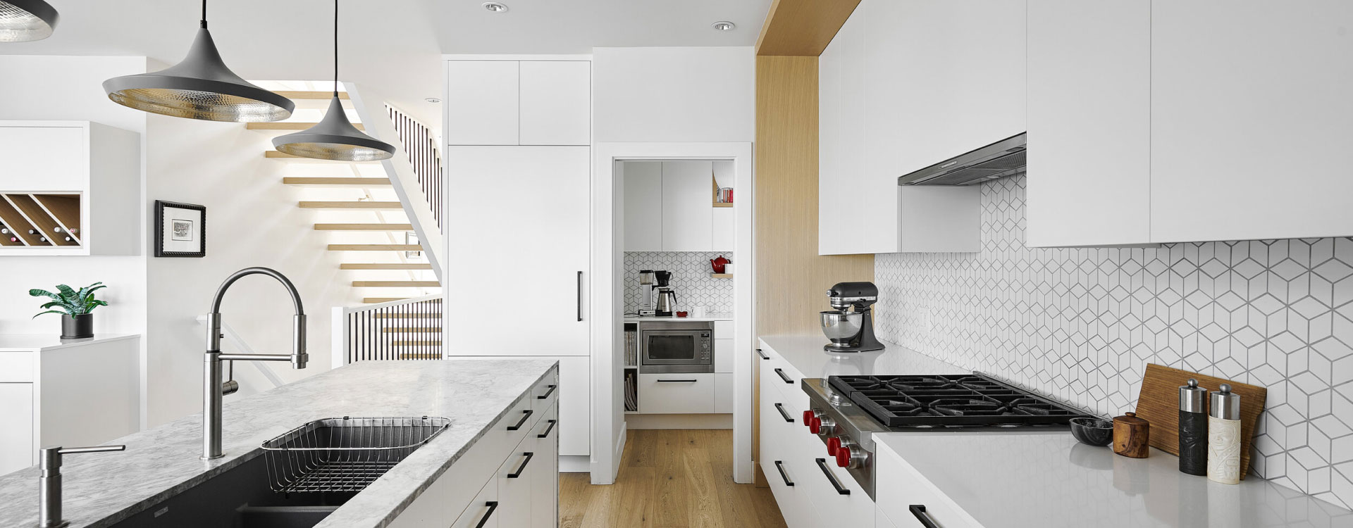 Kitchen renovation and cabinet maker in Melbourne white panel cabinet with marble stone